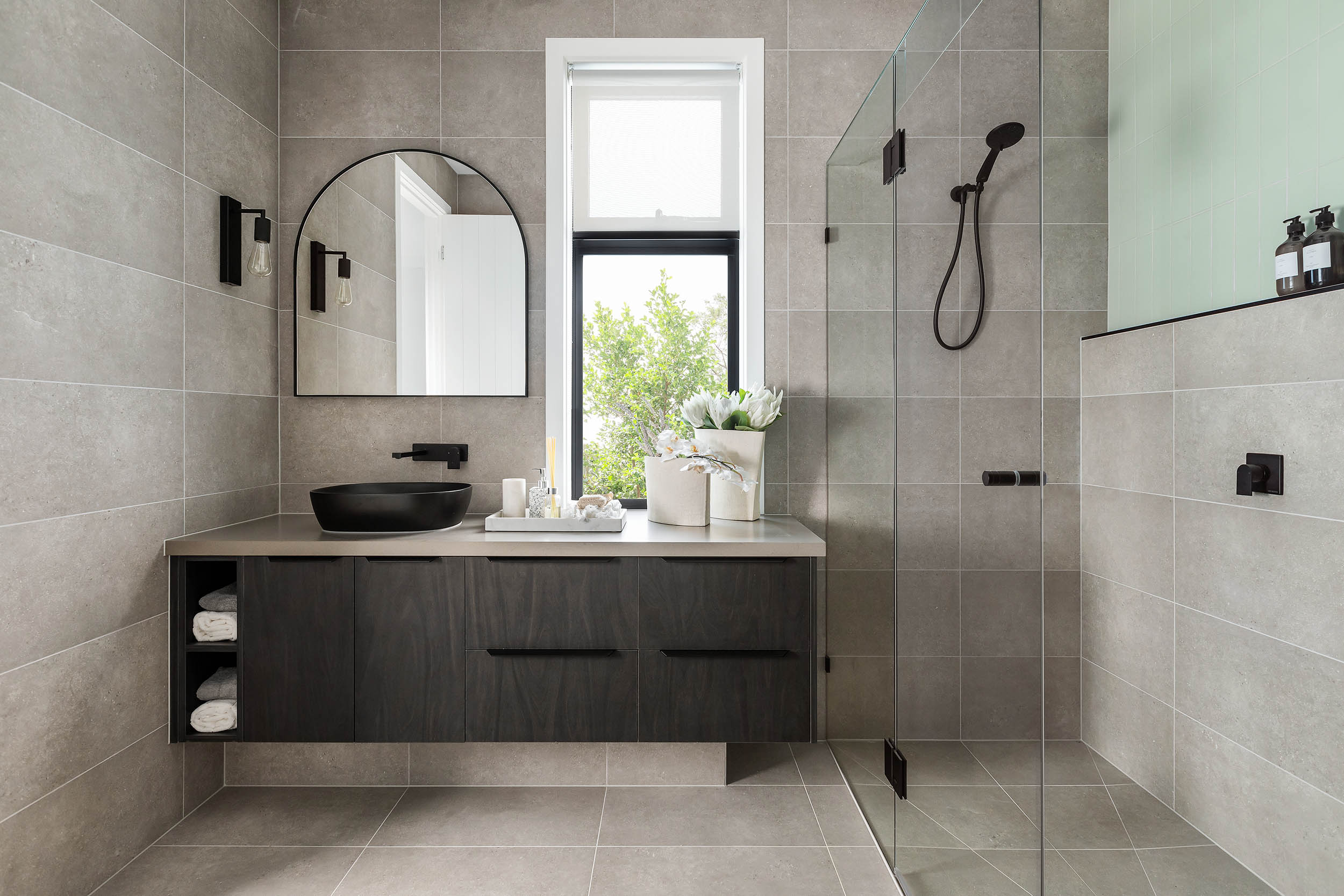 Ensuite with dark floating vanity